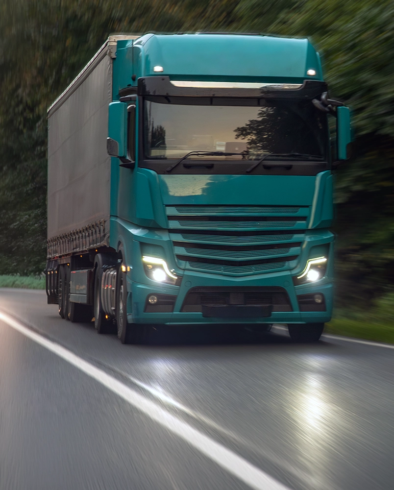 A man sitting on a surfboard, surrounded by ocean waves under a clear blue sky